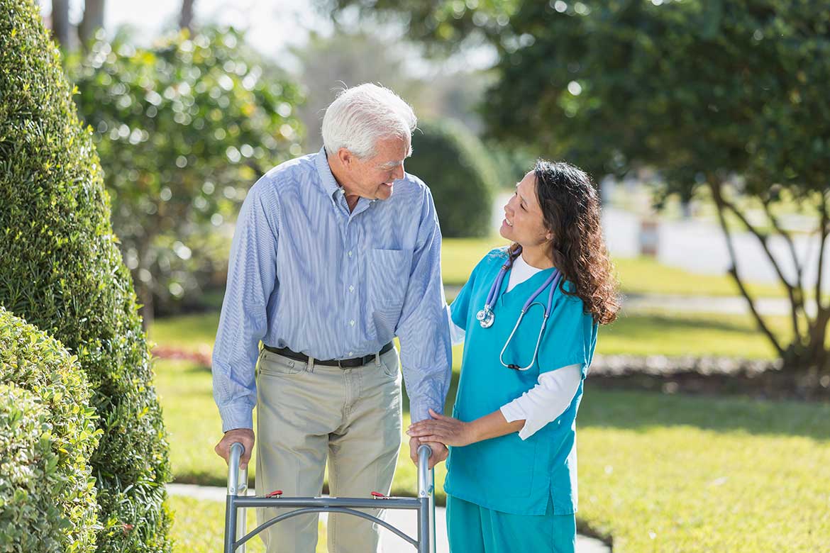 caregiver with hospice patient outside